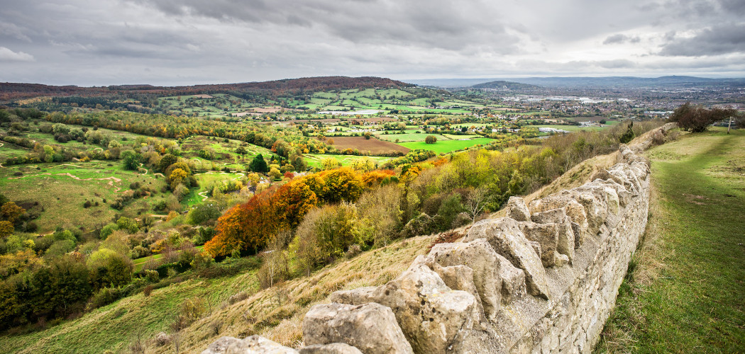 View from top of Crickley Hill of stone wall and countryside